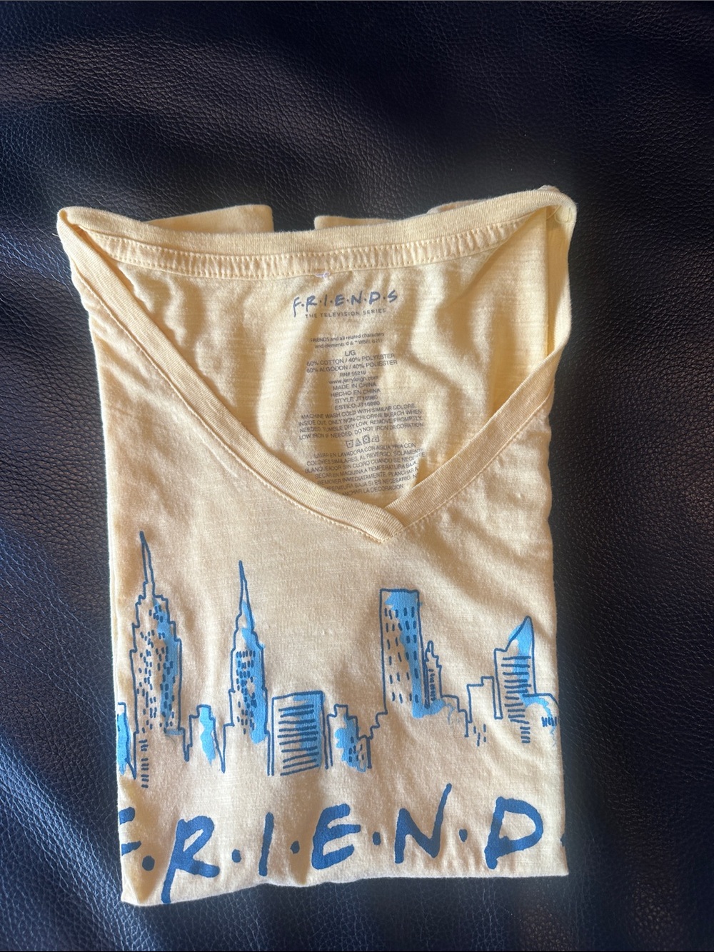 NWOT Friends Yellow V-Neck Tee with Blue Skyline Friends Graphic